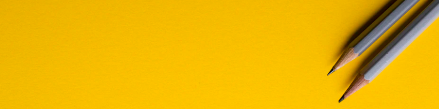 lápices grises fondo amarillo upsplash